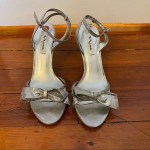 Nina silver heels. Strap around ankle 9.5